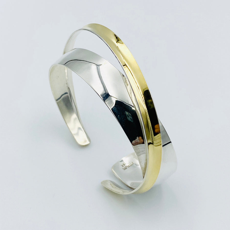 
            
                Load image into Gallery viewer, Cross over cuff 18ct gold top flexible sterling silver
            
        